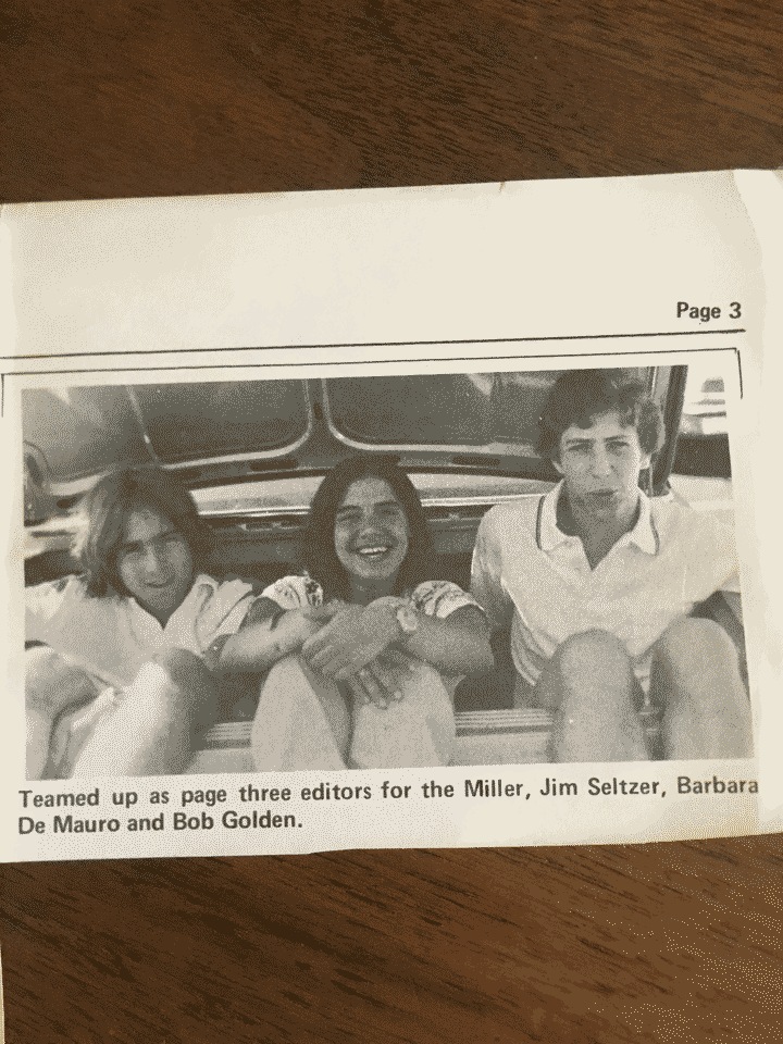 My mom sitting in the trunk of a car with two of her fellow newspaper editors during Earthday parade in NYC
